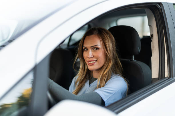 istock Beauty nurse inside a car ready to go home 1797088558