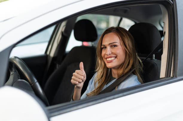 istock Nurse gesturing to be okay with hand inside a car 1797089079