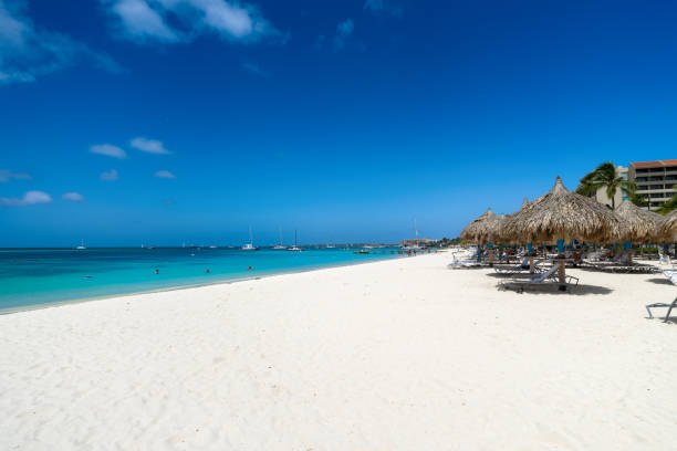 istock Chairs and Palapas on Palm Beach, Aruba 1797098823