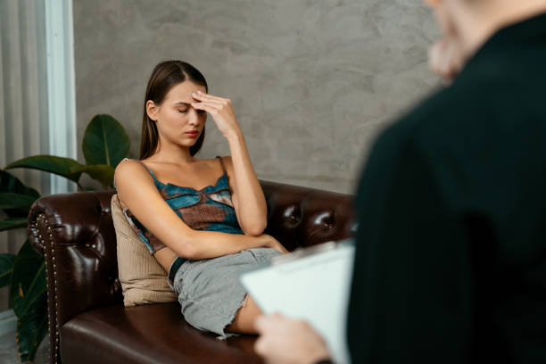 istock Stressed and depressed patient seeking help from psychiatrist. Unveiling 1797100428