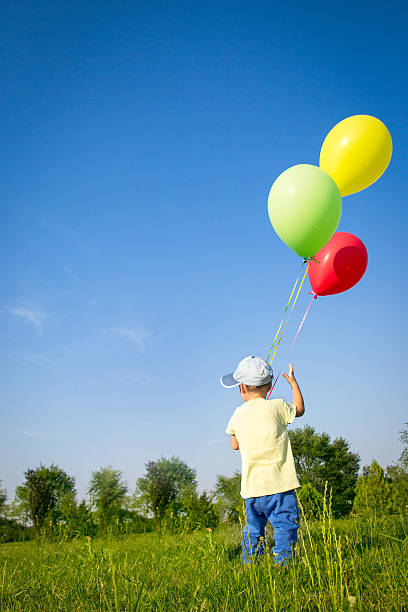 istock Little boy with balloons 179710173