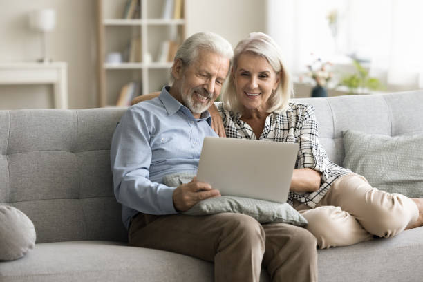 istock Positive retired senior husband and wife using online application 1797109974