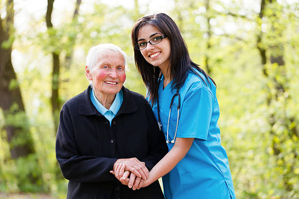 istock Kind Senior Lady with Nurse 179712356