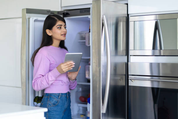 istock Young woman checking what is needed in the home's pantry 1797141030