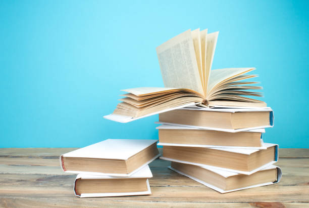 istock open book, books on the blue background. Back to school. Education. Copy space for text. 1797162638