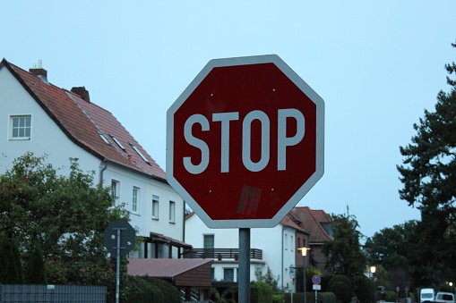 This stock photo features a red octagonal stop sign with the words 