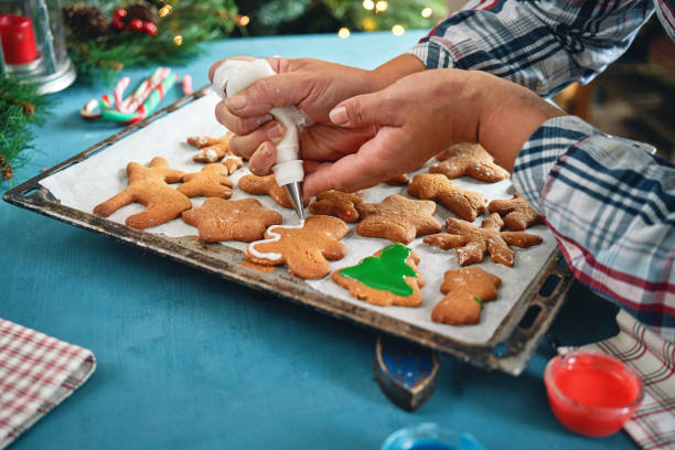 istock Decorating Gingerbread Christmas Cookies with Icing 1797199700
