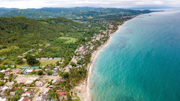 istock an island with a small beach next to a small town 1797211422