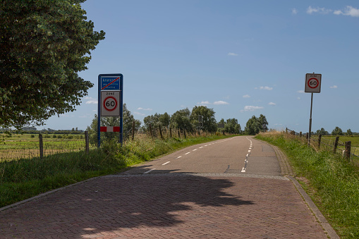 Amerongen, Netherlands, July 17, 2021; Speed ​​limit road sign with maximum speed limit of 60 km per hour.