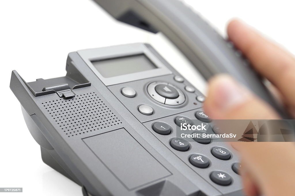 Uomo di prendere in mano il telefono - Foto stock royalty-free di Fax