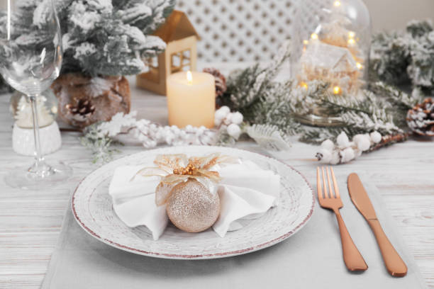istock Festive place setting with beautiful dishware, cutlery and decor for Christmas dinner on white wooden table 1797258776