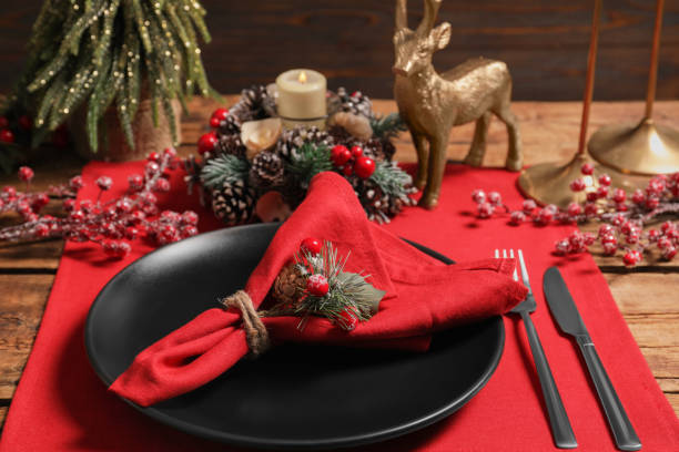 istock Festive place setting with beautiful dishware, cutlery and decor for Christmas dinner on wooden table 1797260982