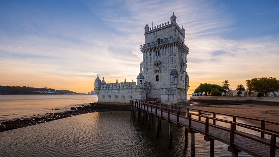 A scenic view of Belem Tower, Ponte 25 de Abril, Lisbon, Portugal, Europe.