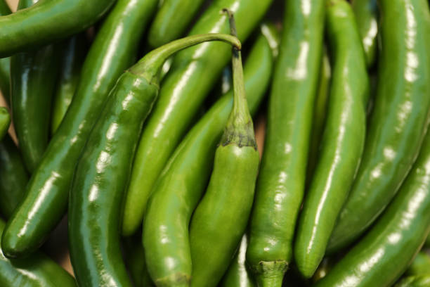 istock Green hot chili peppers as background, closeup 1797274206
