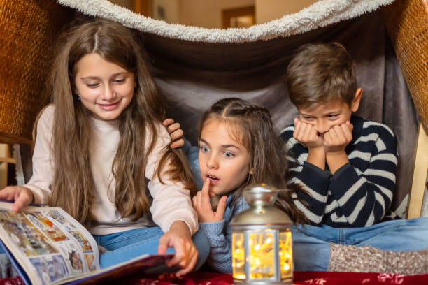 Children With Torches Telling Scary Stories.