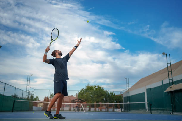 istock Tennis player serving the tennis ball 1797277721
