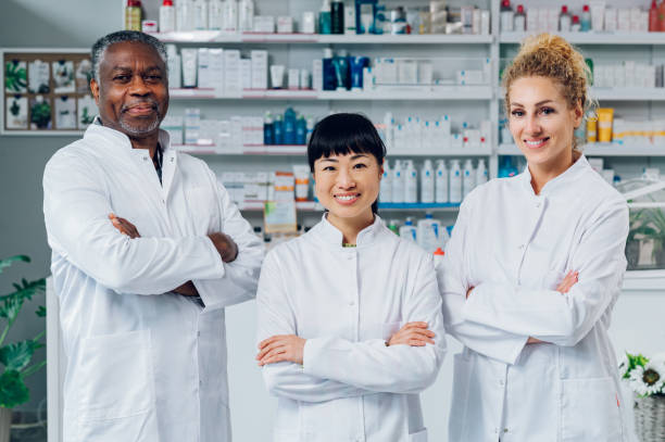 istock Three multiracial coworkers are standing in the pharmacy. 1797292761