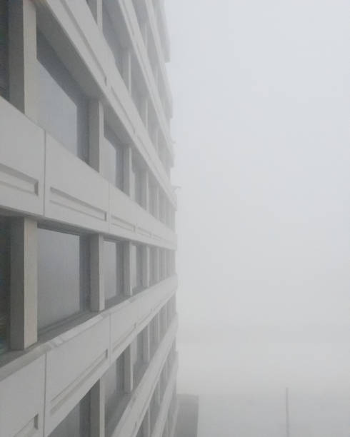 istock Foggy Morning looking out a Window along a side of a Skyscraper 1797294374