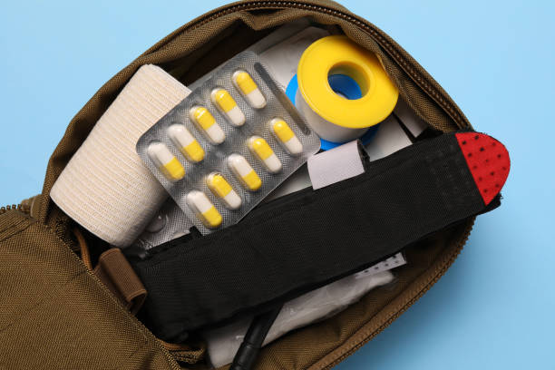 istock Military first aid kit on light blue background, top view 1797295994