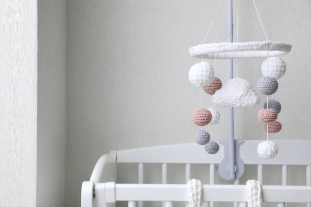 istock Modern baby mobile under crib in children's room 1797307778