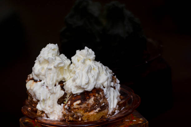Hungarian sponge cake with whipped cream in lights and shadow