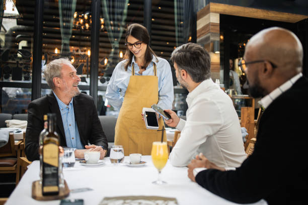 istock Man on a business lunch making a payment 1797325485