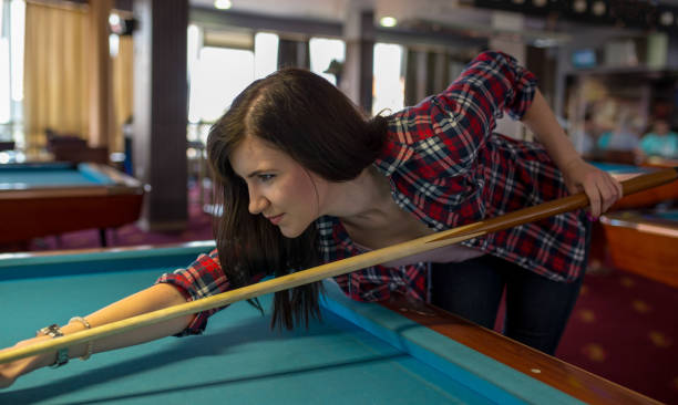 istock Young woman playing pool 1797327567