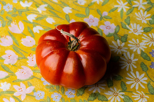 Ripe red tomato on a table.