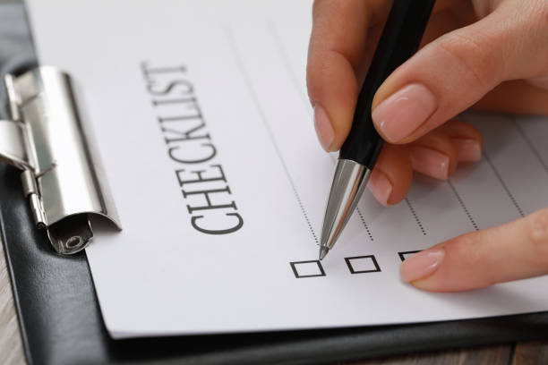 istock Woman filling Checklist at table, closeup view 1797362530