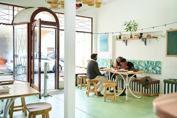 istock Business people having meal in work cafe 1797372988