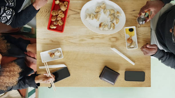 istock Diverse businesspeople having working lunch at chinese restaurant 1797373505