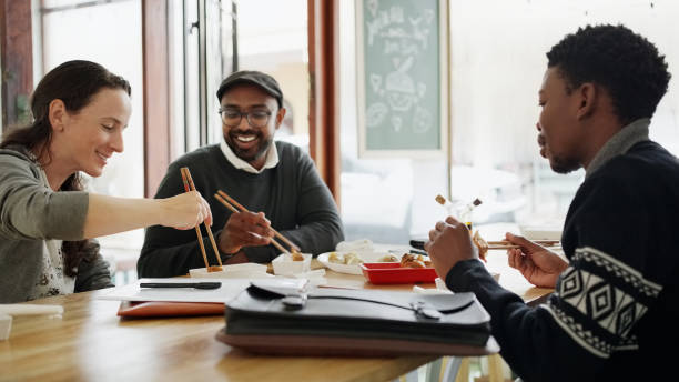 istock Happy diverse business people having lunch at chinese restaurant 1797373513