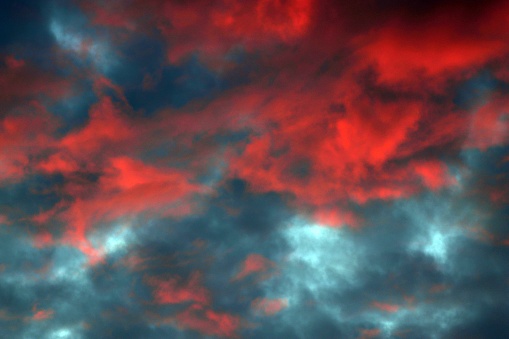 Glowing red clouds with a dark background
