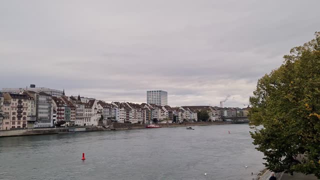 Row Of Buildings By The Rhine River With Overcast Sky In Basel