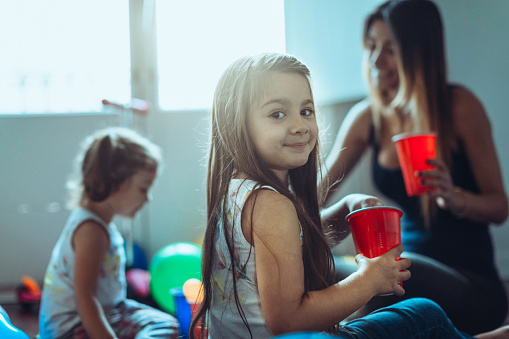 Family at home: mothers and daughters relaxing at home