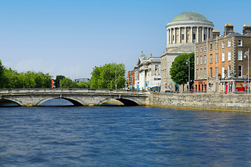 Daytime view of the O’Donovan Rossa bridge and the Four Courts (Dublin, Ireland).