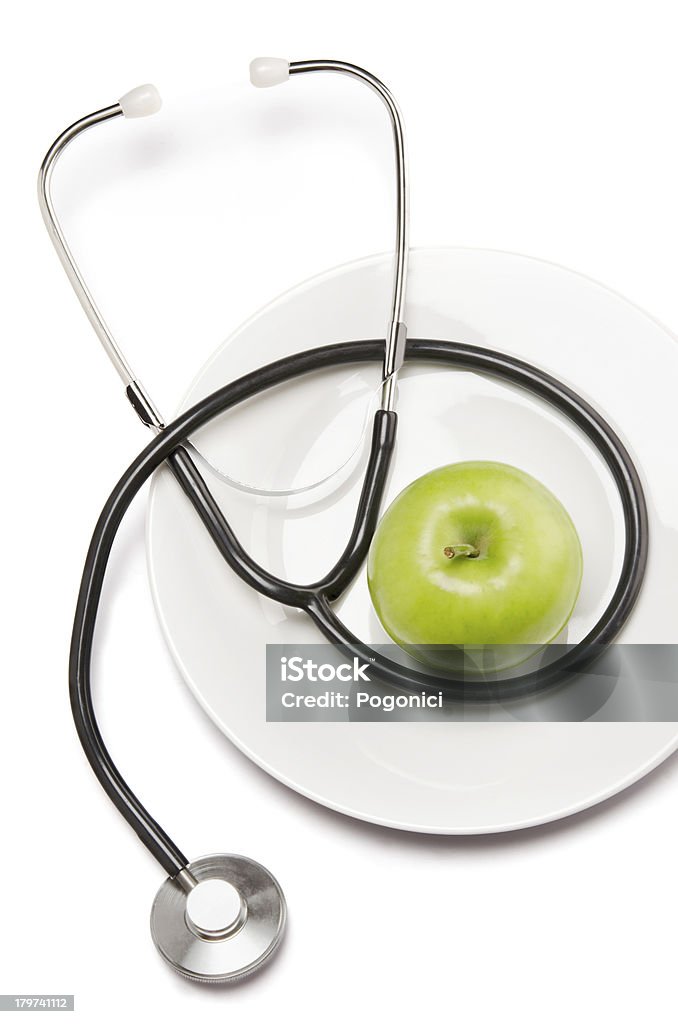 Pomme verte et stéthoscope - Photo de Aliment libre de droits