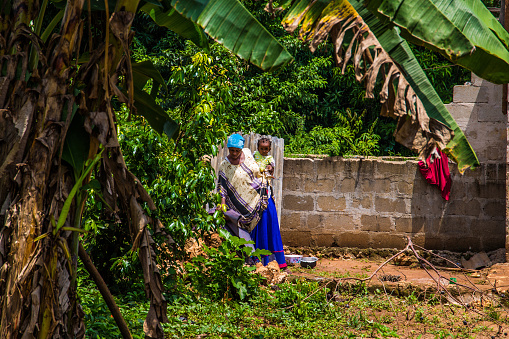 Zanzibar, Tanzania, Africa. 26 March 2018.Stone Town capital of Zanzibar. African woman holding small child