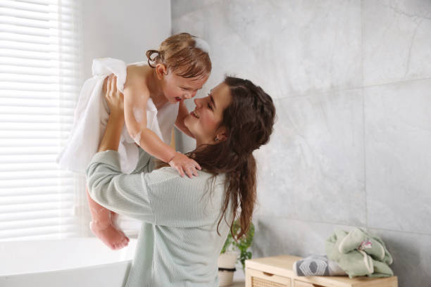 istock Mother with her little daughter in bathroom 1797445312
