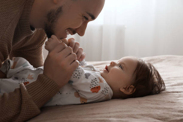 istock Father playing with his daughter at home 1797446378