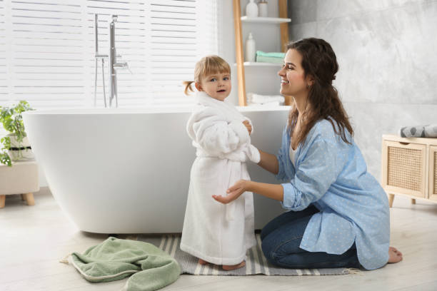 istock Mother with her daughter after bath at home 1797446892
