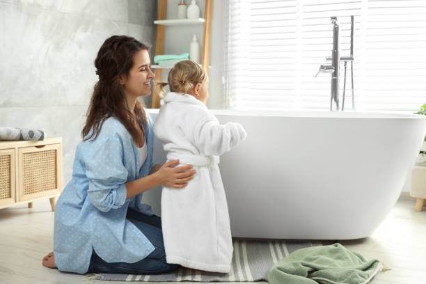 istock Mother with her daughter after bath at home 1797447439