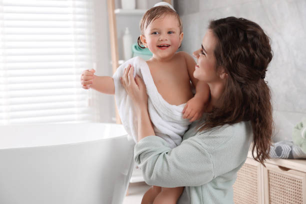 istock Mother with her little daughter in bathroom 1797449019
