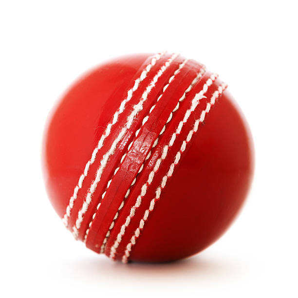 istock Bright red leather cricket ball with white stitching 179747991