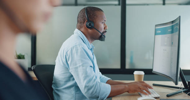 istock Business man, computer and call center consultant in communication, online or technical support. Information technology, IT advisor and African person typing or helping for website solution on screen 1797485644