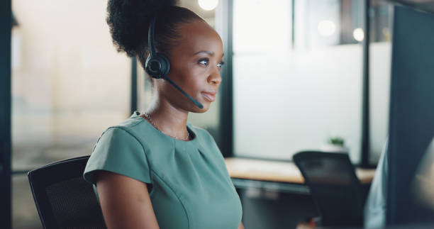 istock Business woman, computer and call center for night communication, customer support and online chat. Advisor, consultant or African person with advice, FAQ update and website management in office 1797485670
