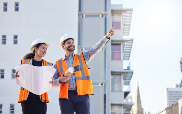Engineering people pointing and blueprint for planning, teamwork or collaboration at construction site. Architecture project, floor plan and contractor or partner show city building development
