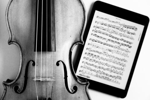 Violin and music sheet on digital tablet.Music concept of the new technology age