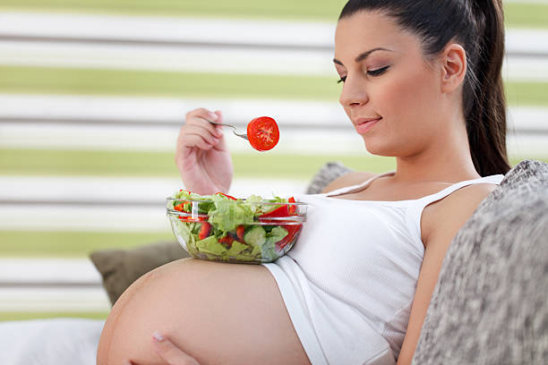istock Healthy pregnancy eating salad 179751366