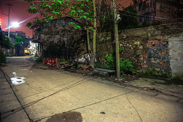 istock old alley at night 179751489